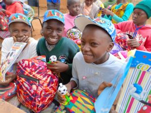 Happy Boys from Mbembani Primary School with School Bag Gifts